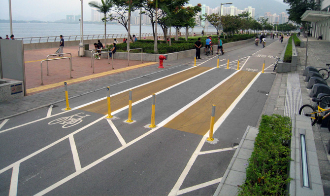 Example of traffic sign and road marking arrangement at pedestrian crossing at a junction with a cycle track