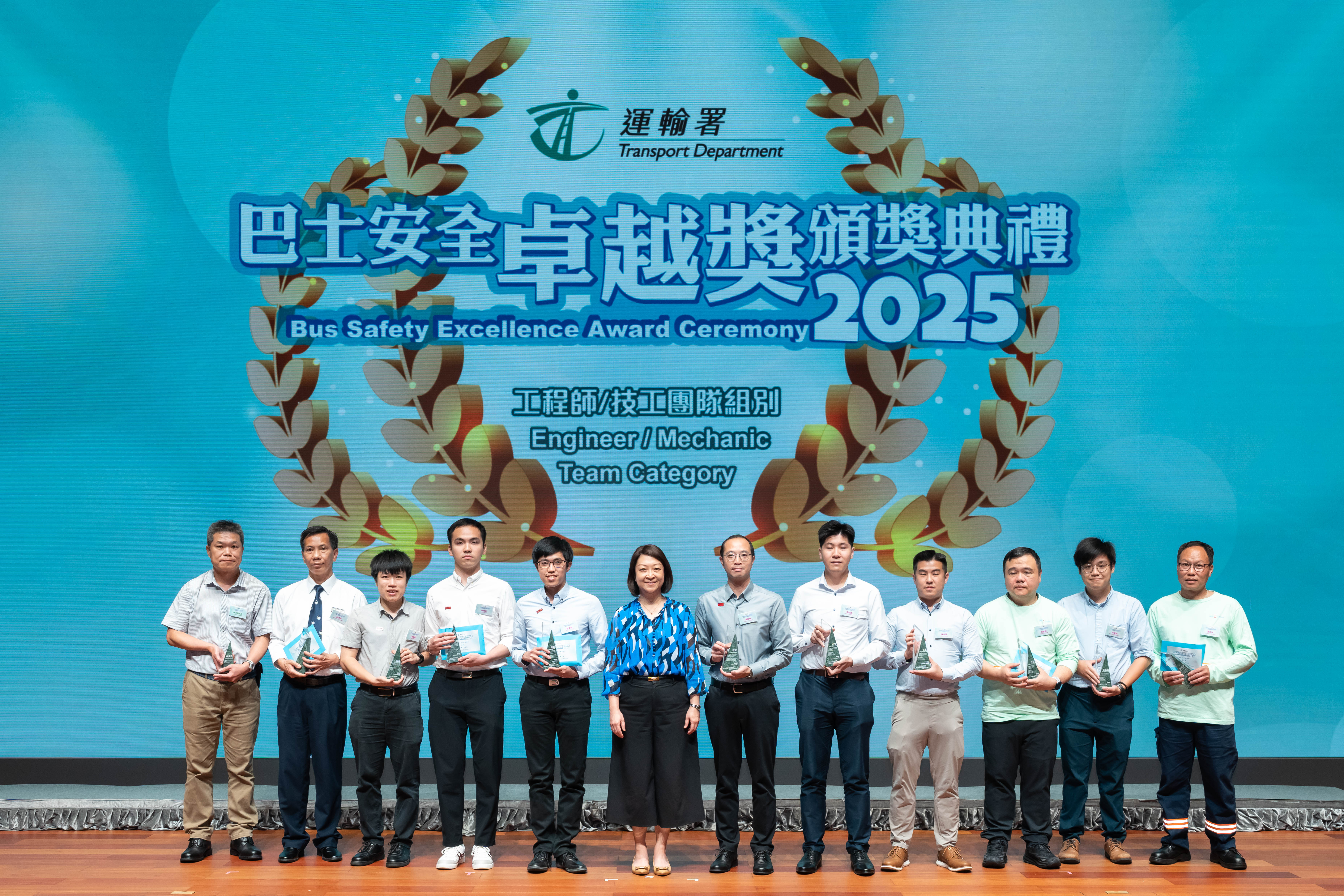 The Commissioner for Transport, Ms Angela Lee (sixth left), with winners of the Engineer/ Mechanic Category